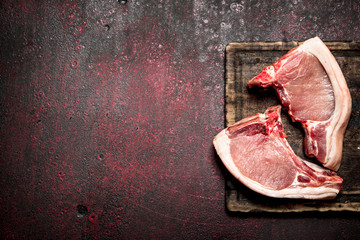 Raw meat background. Raw pieces of pork on the bone.