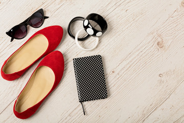 Women's accessories - bracelets, shoes (bllerinas) and sunglasses.