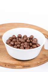 Chocolate round beads marbles sweet cookies macro closeup