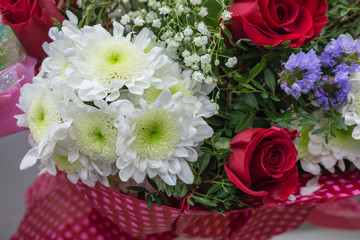 Bunch of large white chrysanthemums and red roses