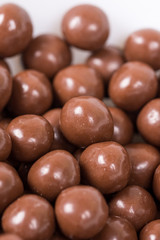 Chocolate round beads marbles sweet cookies macro closeup