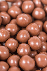 Chocolate round beads marbles sweet cookies macro closeup