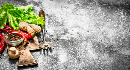 Fresh vegetables . Fresh vegetables with spices and herbs. On rustic background.