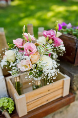 fresh flowers in vases baskets on a table decoration
