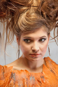 Woman in a orange outfit, portrait, fashion, studio