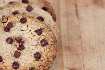 snack: chocolate chip cookies on wooden background  with copy space
