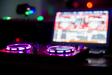 Fototapeta na wymiar DJ mixer at a party / night club