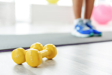 Sportive girl in light gym