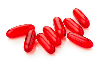 Red pills isolated on white background