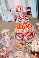 sweet muffins cookies on buffet table