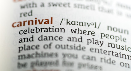 Close up of English dictionary page with definition of the word Carnival 
