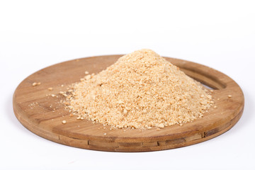 Pile of grounded biscuits on the wooden board