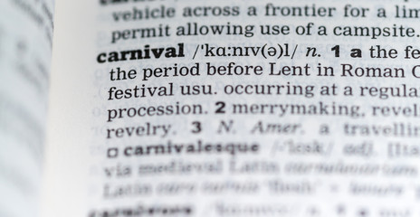 Close up of English dictionary page with definition of the word Carnival