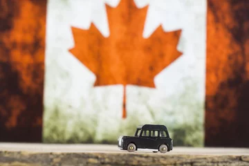 Foto auf Acrylglas Kanada-Flagge und Auto © lucid_dream
