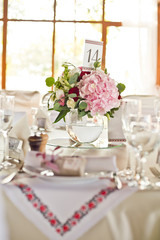 fresh flowers in vases baskets on a table decoration