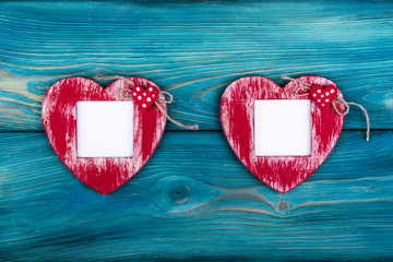 Love card template with blank photo frame heart shaped on the red hearts on blue background