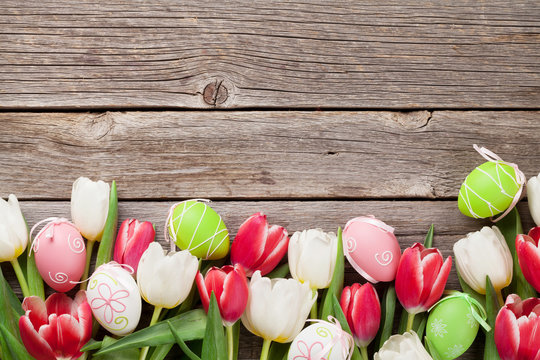 Easter eggs and colorful tulips