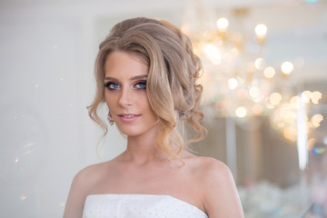 young beautiful bride with make-up and styling