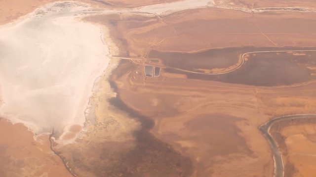 Aerial view of desert area in winter time with lakes and rivers