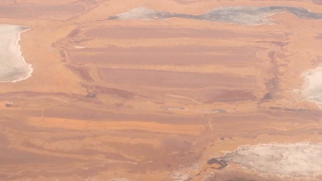 Flyght over lakes in desert area in winter time