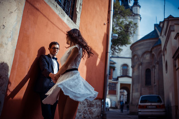 Young couple in love, hugging in the old part of town