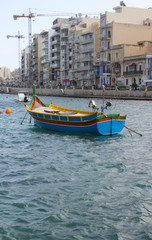 Fototapeta na wymiar Luzzu boat, Spinola bay, Malta
