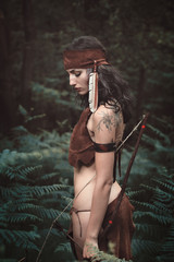Indian huntress in the woods