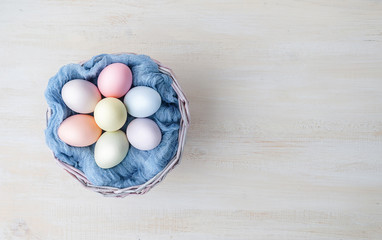 Cute creative photo with easter eggs in the nest