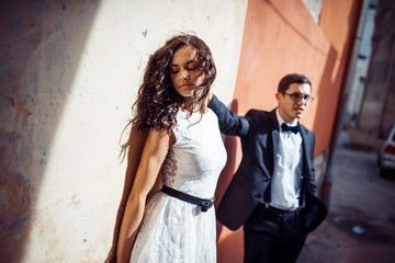 Young couple in love, hugging in the old part of town