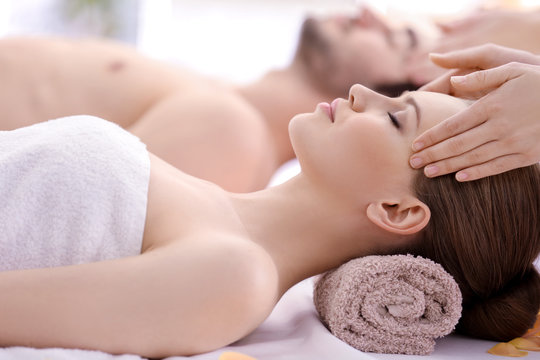 Young Happy Couple Relaxing In Spa Salon