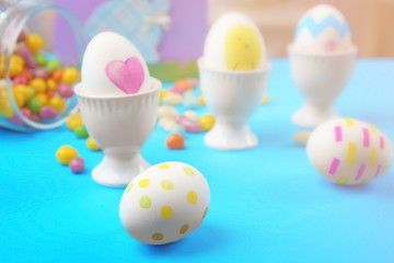 Obraz na płótnie Canvas Composition with painted Easter eggs on table