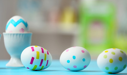 Composition with painted Easter eggs on table