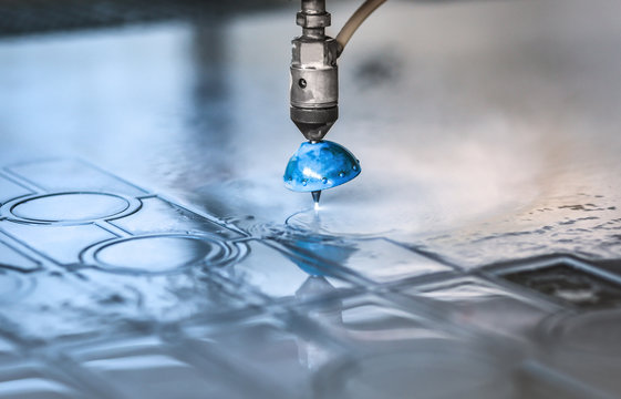 High pressure water jet cutting metal plate.