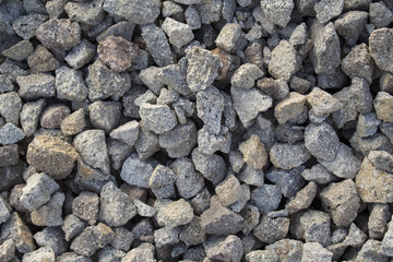 Grey gravel closeup photo for background. Sharp gray stones in pile for construction.