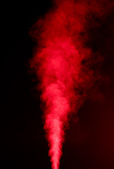 Red vapor on black background