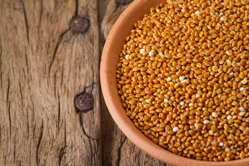 Millet on wooden background