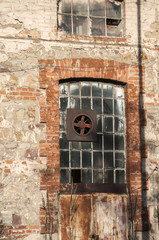 Glass iron window of old grunge abandoned vintage industrial building © varbenov