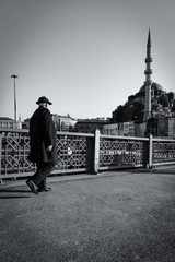 Old man walking on Galata Bridge