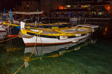 Fototapeta na wymiar Small wooden fishing boats in marine.