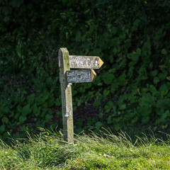 old wooden signpost for backpackers. Lynmouth. North Devon. UK
