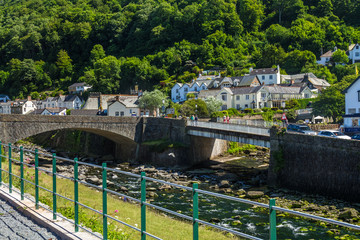 Fototapeta na wymiar Two bridges over the River East Lyn and West Lyn. Two bridges over the River East and West Lin Ling. It are two rivers merge into one. Lynmouth. Devon. UK