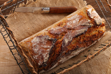 Spelled bread on wooden background