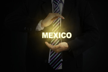 Male entrepreneur protecting word of Mexico