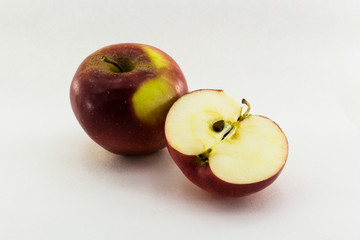 One and a half apple isolated on white background
