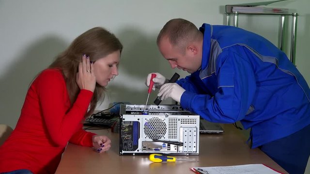 Technical engineer man explain curious customer woman computer problems