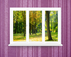 panoramic windows in the room with view to autumnal park