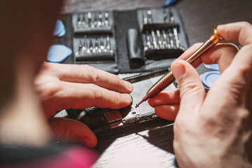 Man Repairing A Mobile phone