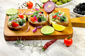 Fototapeta na wymiar Sandwich with fish-herring and salad