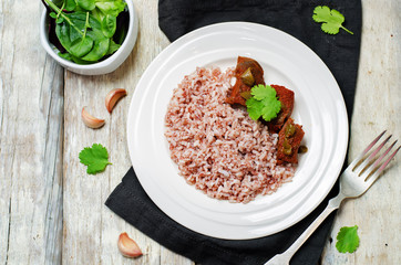 Beef slow cooker with red and white rice and greens