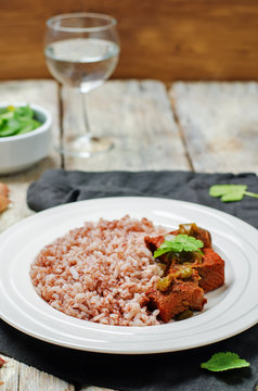 Beef slow cooker with red and white rice and greens